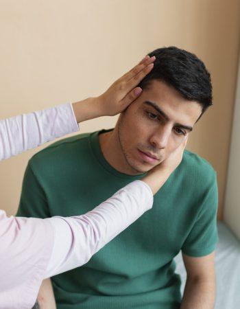 doctor-helping-patient-rehabilitation